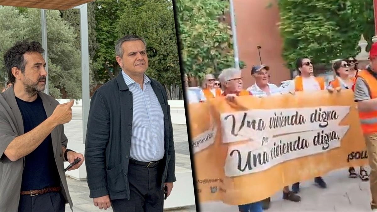 Vecinos afectados por la 7B reciben al consejero de Transportes con pancartas y pitidos